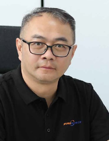 William Tan, General Manager of Sure Source smiling at the camera